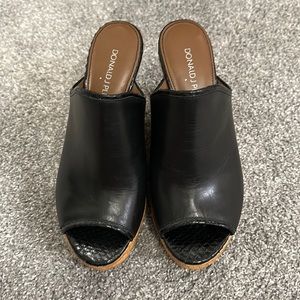 Black wedge backless slides.